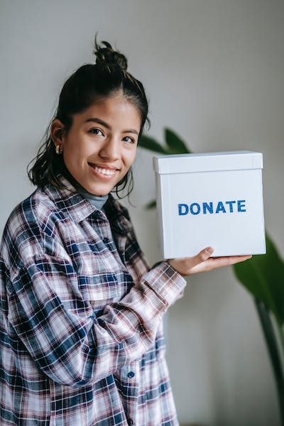 Woman Holding a Donate Box